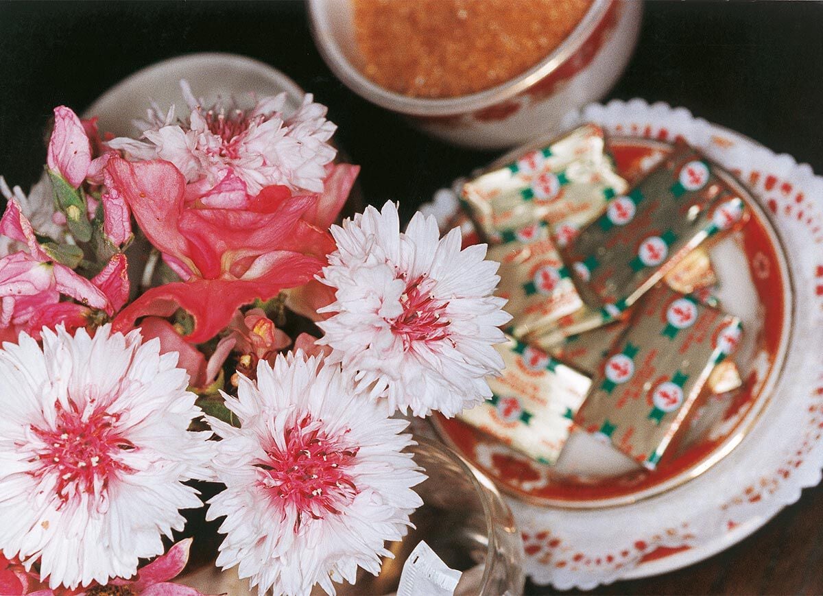 Flowers next to butter on plate &copy; Martin Parr
